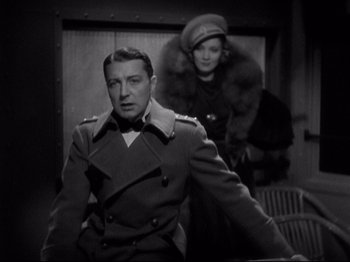 Movie still from “Shanghai Express” (1932), directed by Josef von Sternberg – A man and a woman in military uniforms; Medium shot, Low angle