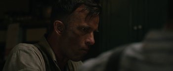 Movie still from “1922” (2017), directed by Zak Hilditch – A person looking down; Close Up shot, Over the shoulder angle