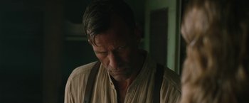 Movie still from “1922” (2017), directed by Zak Hilditch – A person wearing a shirt; Close Up shot, Over the shoulder angle