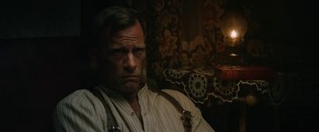 Movie still from “1922” (2017), directed by Zak Hilditch – A person sitting in a chair; Close Up shot, Over the shoulder angle