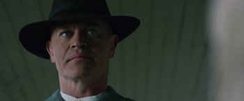 Movie still from “1922” (2017), directed by Zak Hilditch – A person wearing a hat; Close Up shot, Low angle