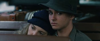 Movie still from “1922” (2017), directed by Zak Hilditch – A man and a woman sitting next to each other; Close Up shot, Low angle