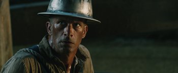 Movie still from “1922” (2017), directed by Zak Hilditch – A person wearing a hat; Close Up shot, Over the shoulder angle