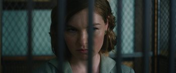 Movie still from “1922” (2017), directed by Zak Hilditch – A woman in a jail cell with her eyes wide open; Close Up shot, Over the shoulder angle