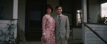 Movie still from “1922” (2017), directed by Zak Hilditch – A man and a woman standing next to each other; Medium shot, Low angle
