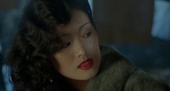 Movie still from “Shanghai Triad” (1995), directed by Yimou Zhang – A person wearing a fur coat; Close Up shot, Over the shoulder angle