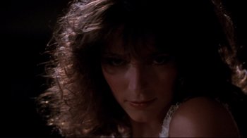Movie still from “Sharky's Machine” (1981), directed by Burt Reynolds – A woman's face with long hair; Close Up shot, Low angle