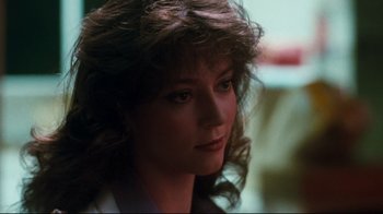 Movie still from “Sharky's Machine” (1981), directed by Burt Reynolds – A person with long hair; Close Up shot, Over the shoulder angle