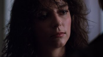 Movie still from “Sharky's Machine” (1981), directed by Burt Reynolds – A woman's face in the dark; Close Up shot, Low angle