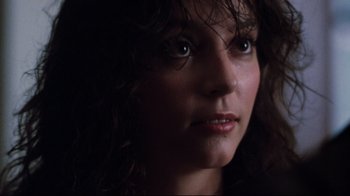 Movie still from “Sharky's Machine” (1981), directed by Burt Reynolds – A woman's face in the dark; Close Up shot, Low angle