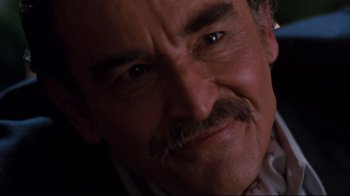 Movie still from “Sharky's Machine” (1981), directed by Burt Reynolds – A man with a mustache; Extreme Close Up shot, Over the shoulder angle