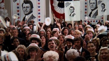 Movie still from “Sharky's Machine” (1981), directed by Burt Reynolds – A group of people in a room with hats on their heads; Wide shot, High angle