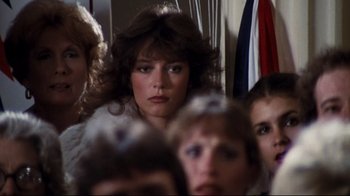 Movie still from “Sharky's Machine” (1981), directed by Burt Reynolds – A group of people standing around a room; Close Up shot, Over the shoulder angle