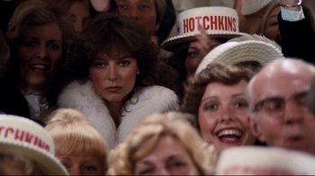 Movie still from “Sharky's Machine” (1981), directed by Burt Reynolds – A group of people that are standing in a room; Close Up shot, Over the shoulder angle