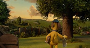 Movie still from “Shaun the Sheep Movie” (2015), directed by Mark Burton – A toy dog with a hat is standing next to a tree; Wide shot, High angle