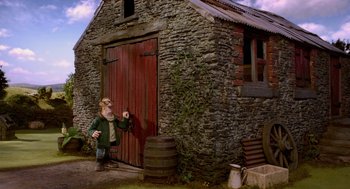 Movie still from “Shaun the Sheep Movie” (2015), directed by Mark Burton – A man standing in front of a barn door; Wide shot, Low angle