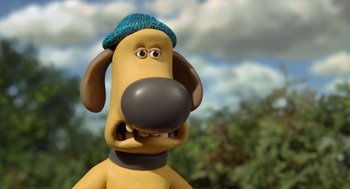 Movie still from “Shaun the Sheep Movie” (2015), directed by Mark Burton – A toy dog with a blue hat on his head; Close Up shot, Low angle
