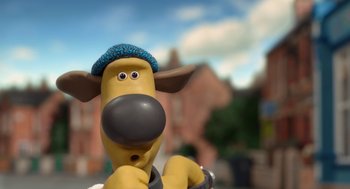 Movie still from “Shaun the Sheep Movie” (2015), directed by Mark Burton – A toy dog wearing a blue hat; Close Up shot, Low angle