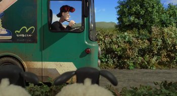 Movie still from “Shaun the Sheep Movie” (2015), directed by Mark Burton – A sheep looking out the window of a bus; Medium shot, High angle