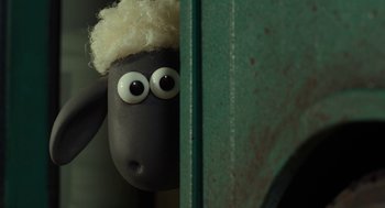 Movie still from “Shaun the Sheep Movie” (2015), directed by Mark Burton – A toy sheep with eyes and hair sticking out of it's head; Close Up shot, High angle