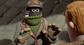 Movie still from “Shaun the Sheep Movie” (2015), directed by Mark Burton – A person wearing a costume; Close Up shot, Low angle