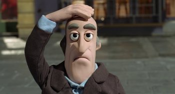 Movie still from “Shaun the Sheep Movie” (2015), directed by Mark Burton – The head of an animated character; Close Up shot, Over the shoulder angle