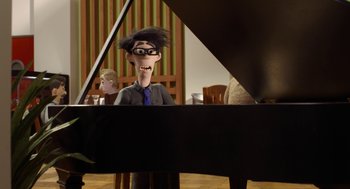 Movie still from “Shaun the Sheep Movie” (2015), directed by Mark Burton – A man sitting in front of a grand piano; Medium shot, Over the shoulder angle