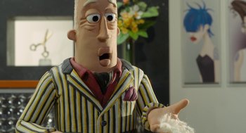 Movie still from “Shaun the Sheep Movie” (2015), directed by Mark Burton – A man in a striped suit; Close Up shot, Over the shoulder angle