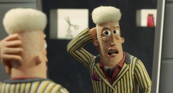 Movie still from “Shaun the Sheep Movie” (2015), directed by Mark Burton – A man in a striped suit is looking at himself in the mirror; Close Up shot, Over the shoulder angle