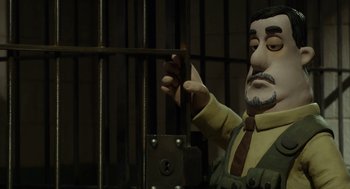 Movie still from “Shaun the Sheep Movie” (2015), directed by Mark Burton – A man in a suit and tie standing in front of a jail cell; Close Up shot, Low angle