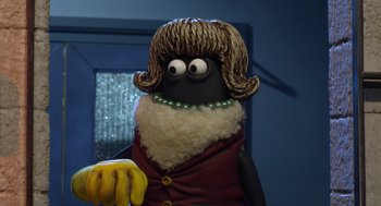 Movie still from “Shaun the Sheep Movie” (2015), directed by Mark Burton – A person wearing a wig and holding a banana; Close Up shot, Over the shoulder angle