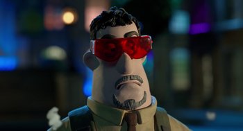 Movie still from “Shaun the Sheep Movie” (2015), directed by Mark Burton – A toy character wearing red glasses; Close Up shot, Low angle