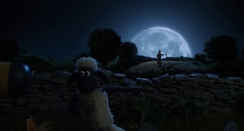 Movie still from “Shaun the Sheep Movie” (2015), directed by Mark Burton – A stuffed sheep is standing in front of a full moon; Wide shot, Low angle