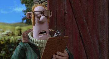 Movie still from “Shaun the Sheep Movie” (2015), directed by Mark Burton – A man in a green sweater holding a clipboard; Close Up shot, Low angle