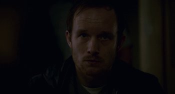 Movie still from “22 July” (2018), directed by Paul Greengrass – A person wearing a black jacket; Close Up shot, Low angle