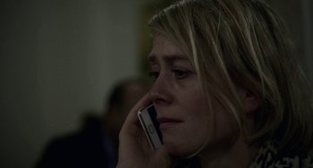 Movie still from “22 July” (2018), directed by Paul Greengrass – A person talking on a cell phone; Close Up shot, High angle