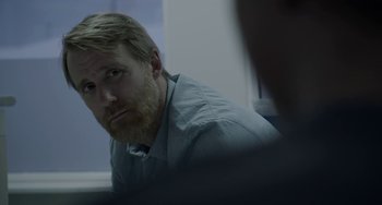 Movie still from “22 July” (2018), directed by Paul Greengrass – A man sitting in front of a computer screen; Close Up shot, Over the shoulder angle