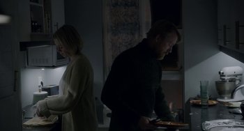 Movie still from “22 July” (2018), directed by Paul Greengrass – A man and a woman standing next to each other in a room; Medium shot, Low angle