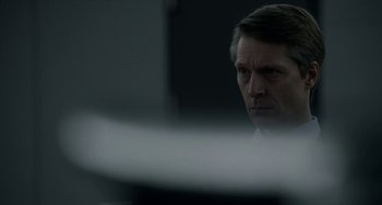 Movie still from “22 July” (2018), directed by Paul Greengrass – A person sitting in front of a computer; Close Up shot, Over the shoulder angle