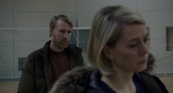 Movie still from “22 July” (2018), directed by Paul Greengrass – A man and a woman are looking at each other; Close Up shot, Over the shoulder angle