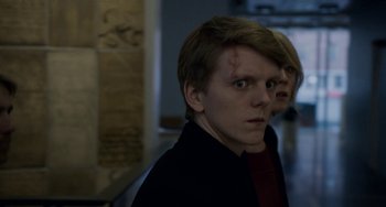 Movie still from “22 July” (2018), directed by Paul Greengrass – A man and a woman looking at the camera; Close Up shot, Over the shoulder angle