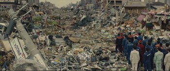 Movie still from “Shin Godzilla” (2016), directed by Shinji Higuchi – A large pile of rubble in the middle of a city; Extreme Wide shot, High angle