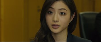 Movie still from “Shin Godzilla” (2016), directed by Shinji Higuchi – A person with long black hair; Close Up shot, Over the shoulder angle