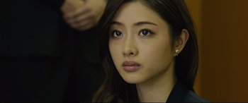 Movie still from “Shin Godzilla” (2016), directed by Shinji Higuchi – A person with long hair; Close Up shot, Over the shoulder angle