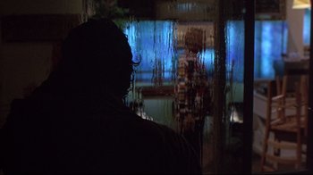 Movie still from “Shine” (1996), directed by Scott Hicks – A person standing in front of a window; Close Up shot, Over the shoulder angle