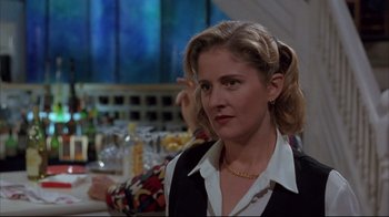 Movie still from “Shine” (1996), directed by Scott Hicks – A woman in a white shirt and a black vest; Close Up shot, Over the shoulder angle