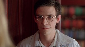 Movie still from “Shine” (1996), directed by Scott Hicks – A young man wearing glasses and a white shirt; Close Up shot, Low angle