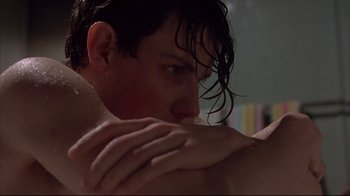 Movie still from “Shine” (1996), directed by Scott Hicks – A person with their hands on his chest; Close Up shot, Low angle
