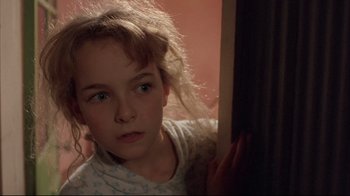 Movie still from “Shine” (1996), directed by Scott Hicks – A young girl is leaning against a wall; Close Up shot, High angle