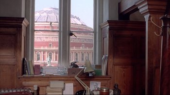 Movie still from “Shine” (1996), directed by Scott Hicks – A view of a large building from a window; Extreme Wide shot, Low angle